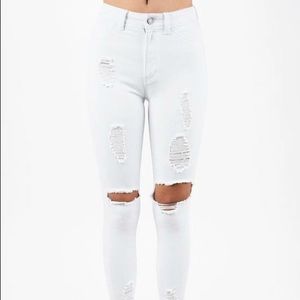 Destroyed white skinny jeans